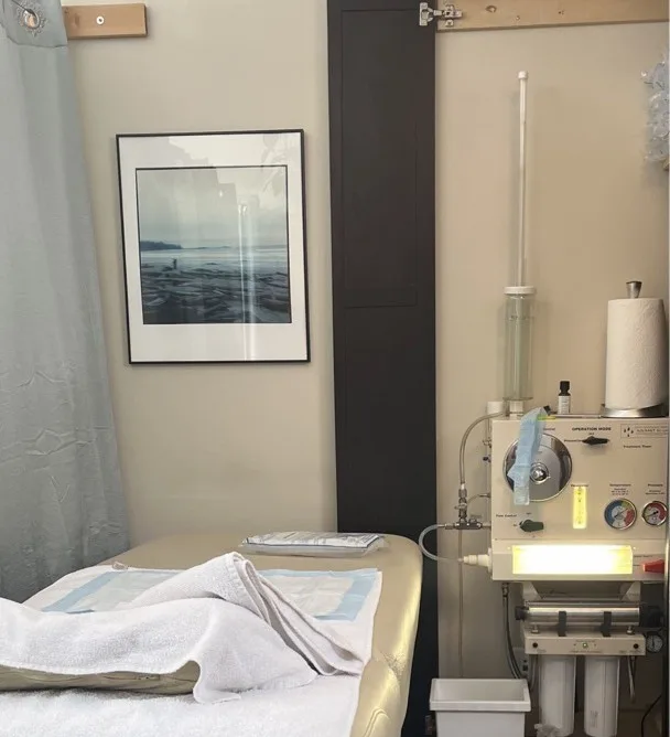 Vestta’s private treatment room with a prepared table and colon hydrotherapy equipment